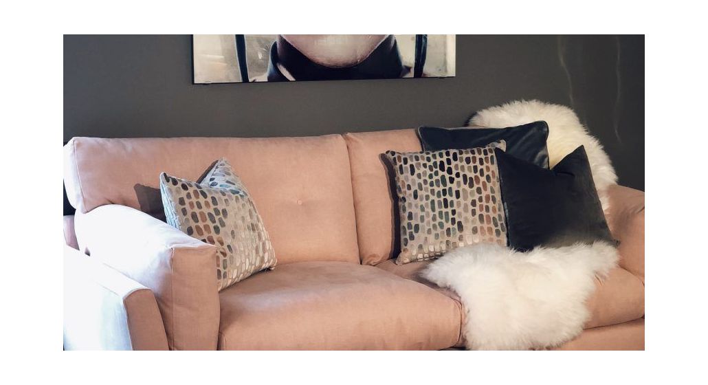 peach sofa with cushions